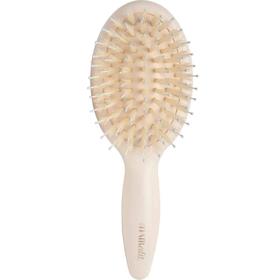 The Hair Edit mini brush front view showing sleek compact design and travel convenience