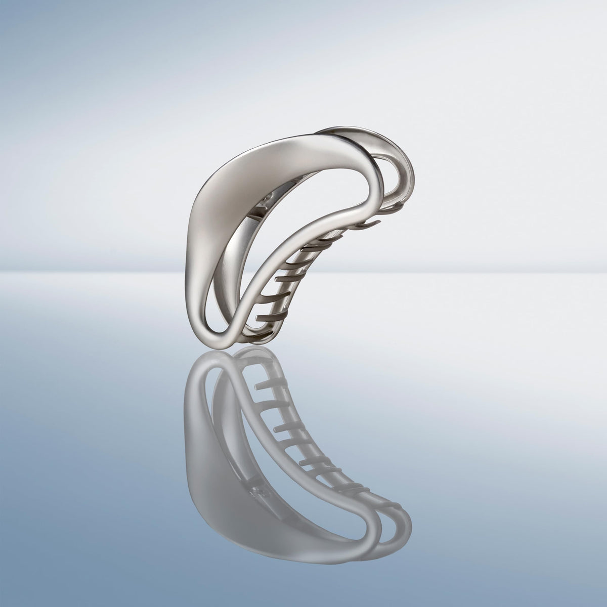 The Hair Edit clip in a half-up hairstyle adding polished, minimalist style