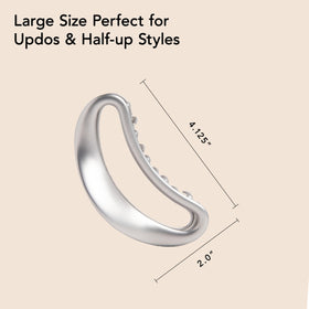 The Hair Edit clip held in hand to show large size and easy one-handed use