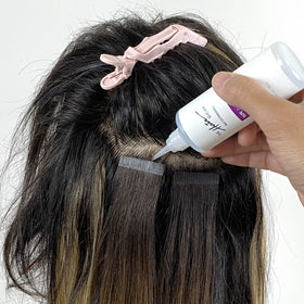 The Hair Shop product in salon use easing tape-in removal process