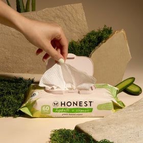 The Honest Company wipe held in hand demonstrating large size and convenient use