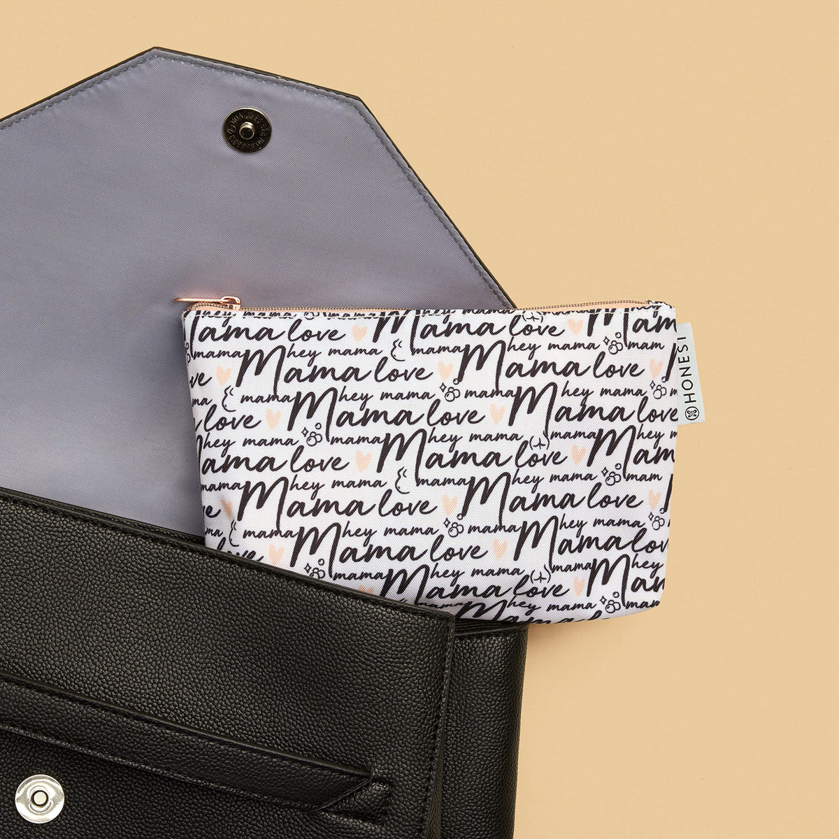The Honest Company travel-sized products beside a hand to show compact scale