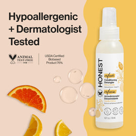The Honest Company spray nozzle detail delivering fine mist for gentle detangling