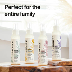 Detangler bottle tucked in a travel bag showing convenience for on-the-go styling