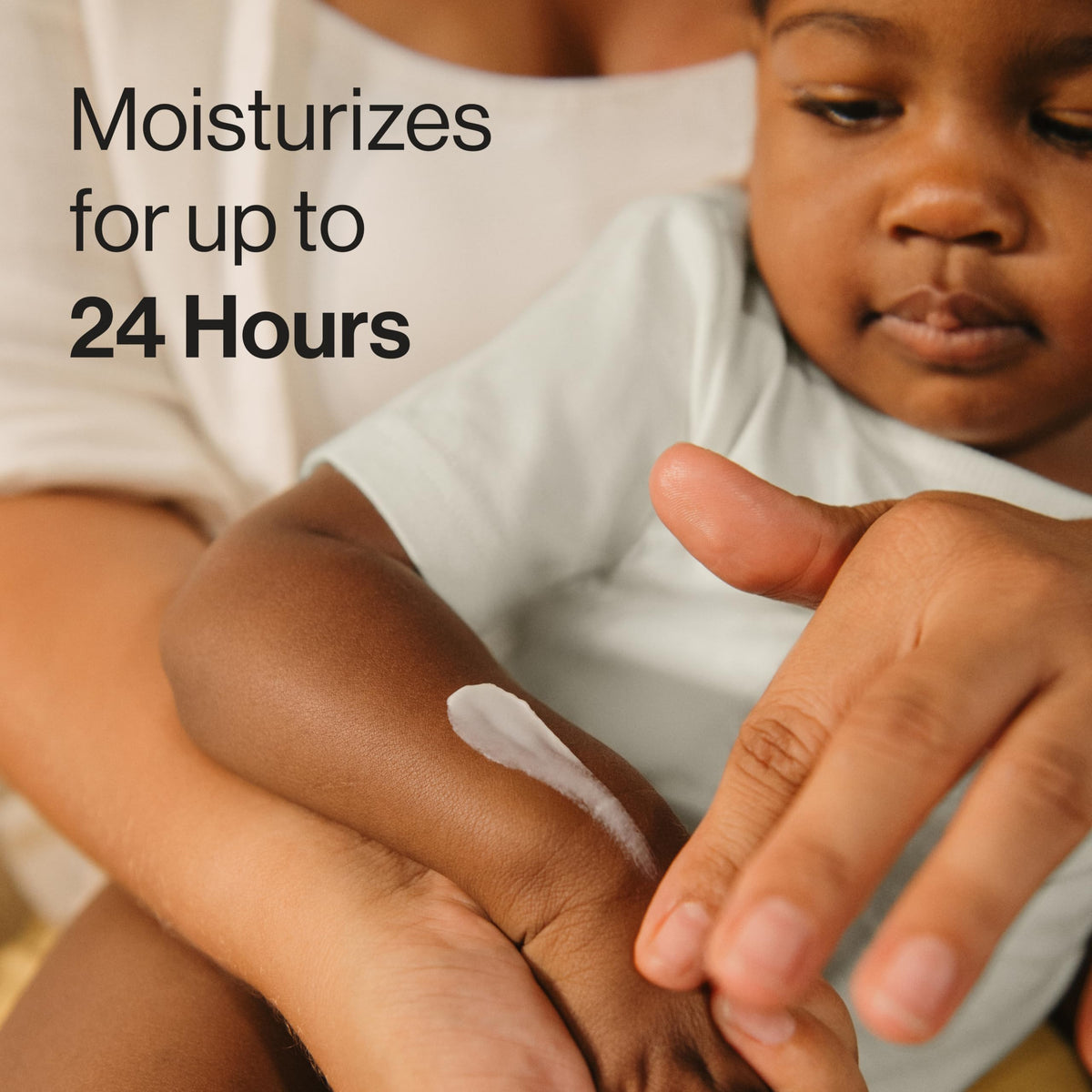 Close-up texture of lotion from The Honest Company showing fast-absorbing finish