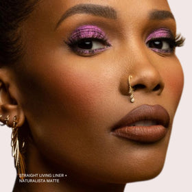 The Lip Bar lifestyle shot with model wearing soft brown for wearable confidence