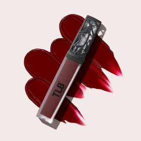 The Lip Bar on lips in studio lighting illustrating true deep blood-red payoff