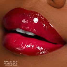 Model wearing The Lip Bar Rich Auntie in evening look showing striking deep berry impact benefit