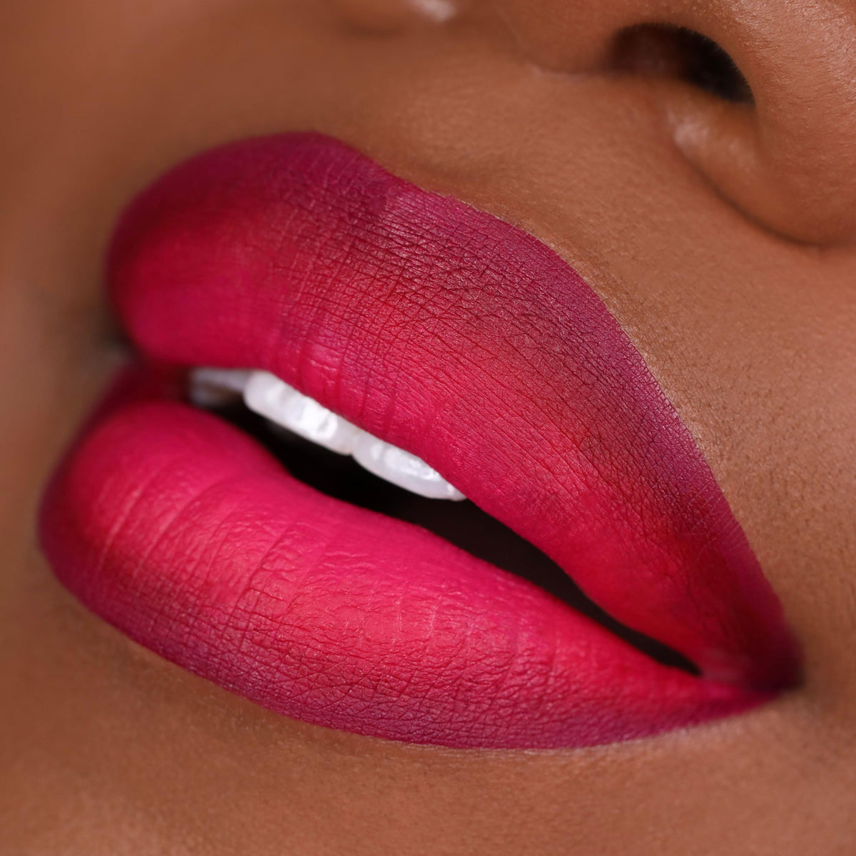 Close-up swatches of The Lip Bar shades Bawse Lady, Muse, Playmate, clear color payoff