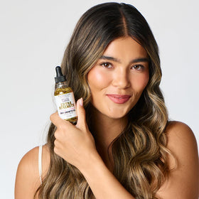 The Mane Attraction ingredient display with castor and rosemary benefits