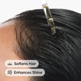 The Ordinary argan oil applied to hair ends to show added softness and shine