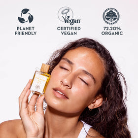 The Organic Skin Co. bottle beside a ruler illustrating compact 30mL travel-friendly benefit