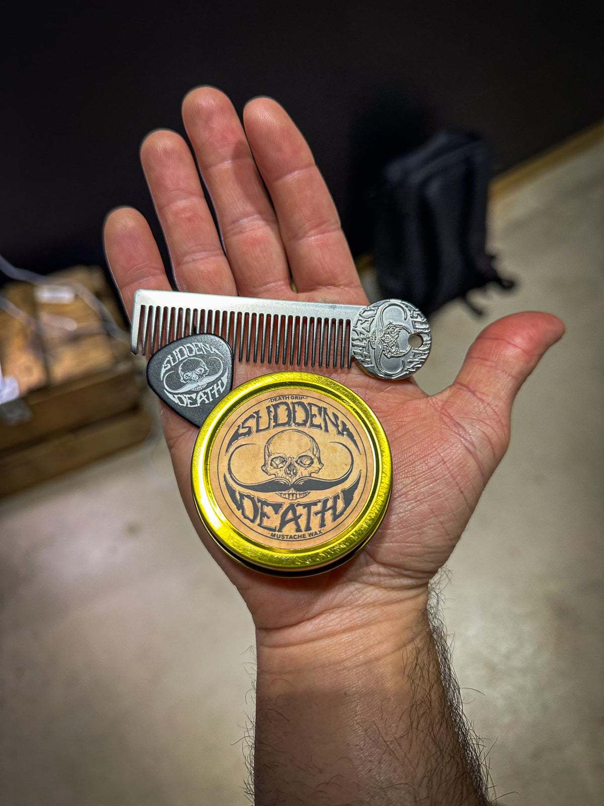 THE VINTAGE GROOMING CO. open Sudden Death wax texture on tin highlighting pliable, tacky consistency