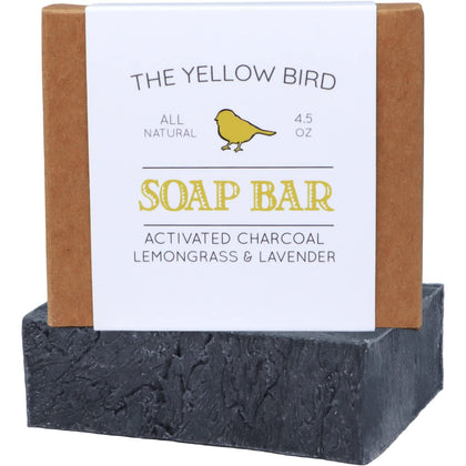 The Yellow Bird front packaging view showing charcoal soap and natural ingredients benefit