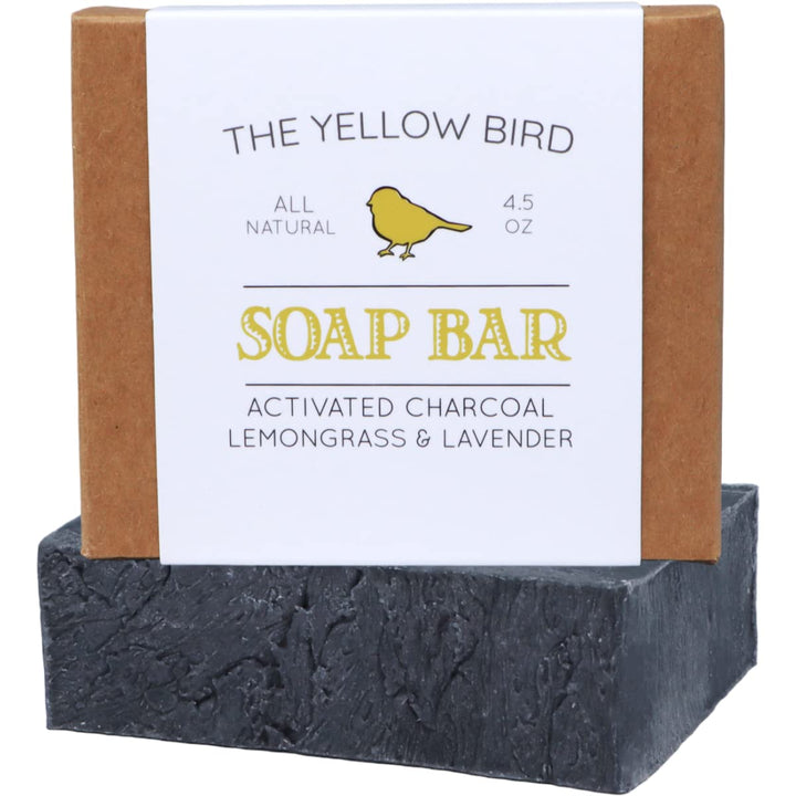 The Yellow Bird front packaging view showing charcoal soap and natural ingredients benefit