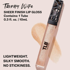 The Lip Bar doe-foot applicator loaded with champagne shimmer gloss for precise application