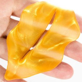 Theshiry peeled-off mask with remaining serum showing how to massage nutrients in