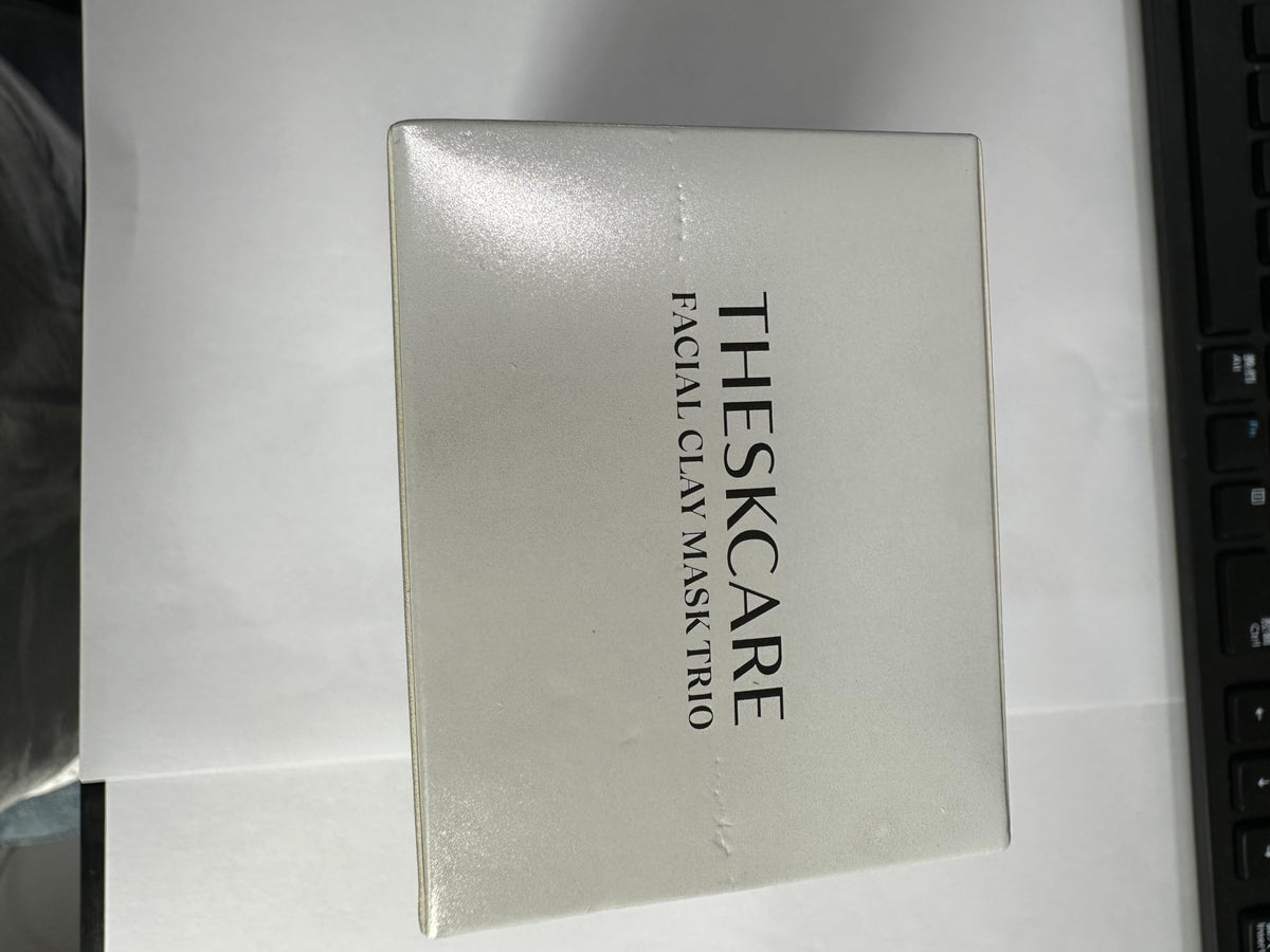 THESKCARE mask being applied to cheek in lifestyle shot demonstrating use