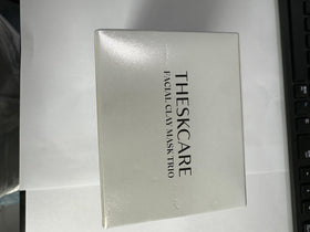 THESKCARE mask being applied to cheek in lifestyle shot demonstrating use