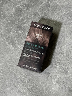 Thick Fiber kit held in hand to show compact travel-friendly size and convenience