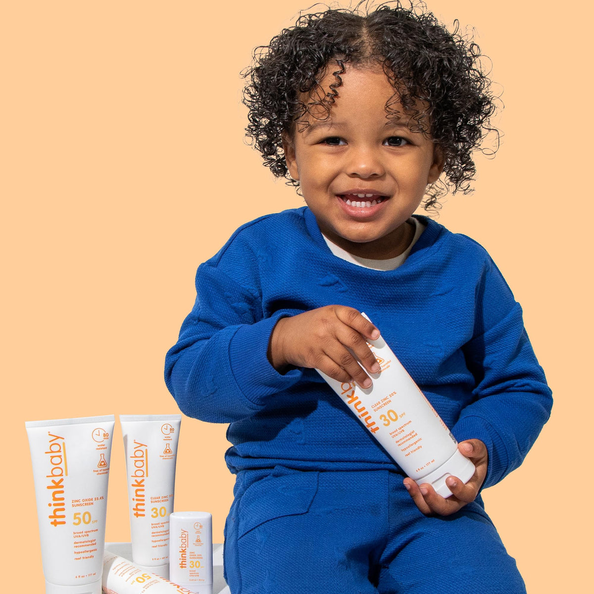 Thinkbaby applied on a toddler arm demonstrating easy spread and non-greasy finish
