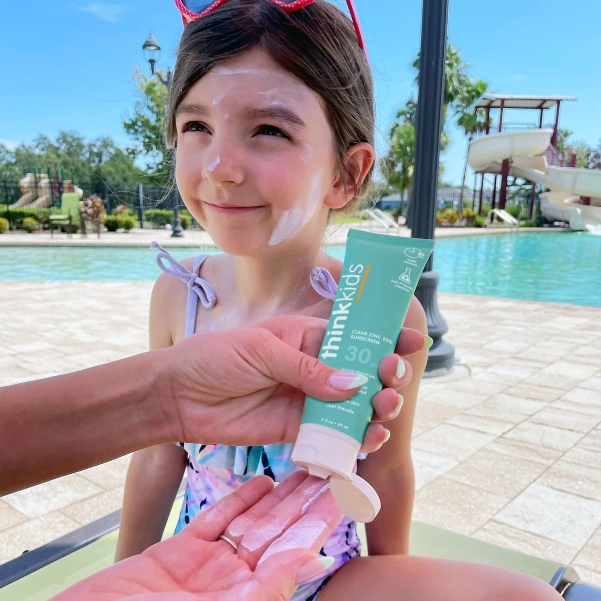 THINK kids sunscreen applied on child arm showing easy rub-in