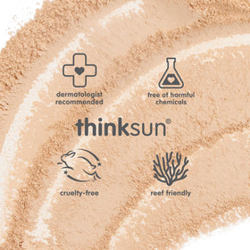THINK Thinkkids compact brush shown in hand for travel convenience