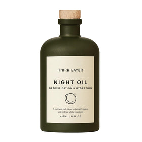 Third Layer bottle front view showing clean organic packaging and premium glass advantage