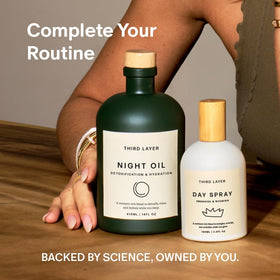 Third Layer hand holding bottle for scale showing travel-friendly 3.3 fl oz size