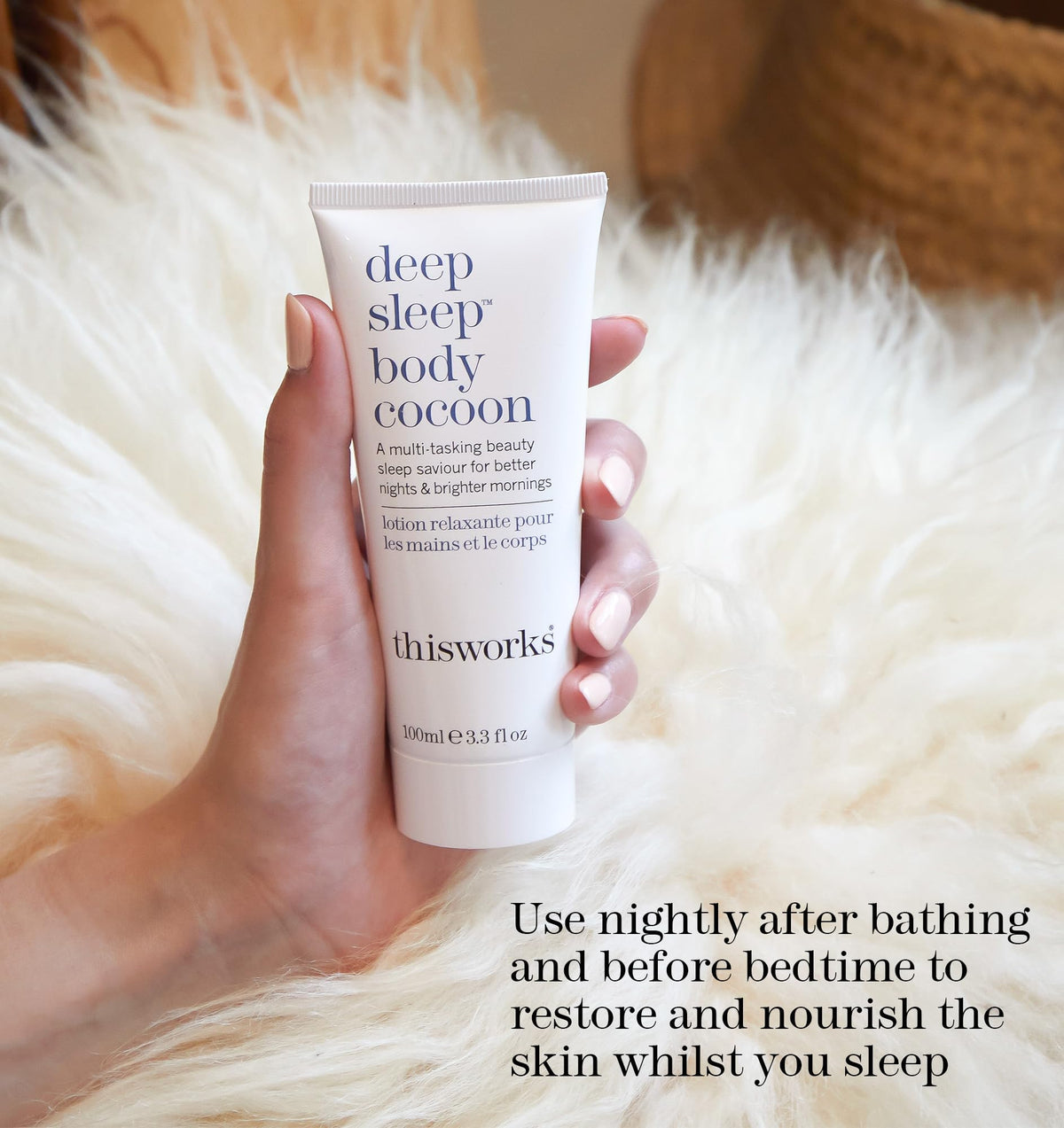 THISWORKS 100ml tube next to travel items showing compact travel-friendly benefit