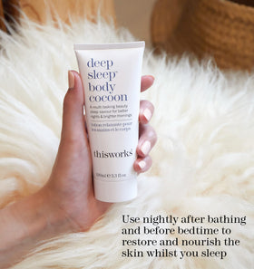THISWORKS 100ml tube next to travel items showing compact travel-friendly benefit