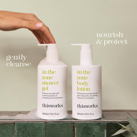 THISWORKS bottle beside common objects illustrating 300ml scale and portability