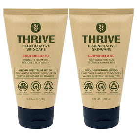 Thrive Natural Care front packaging showing SPF50 and reef-safe benefit