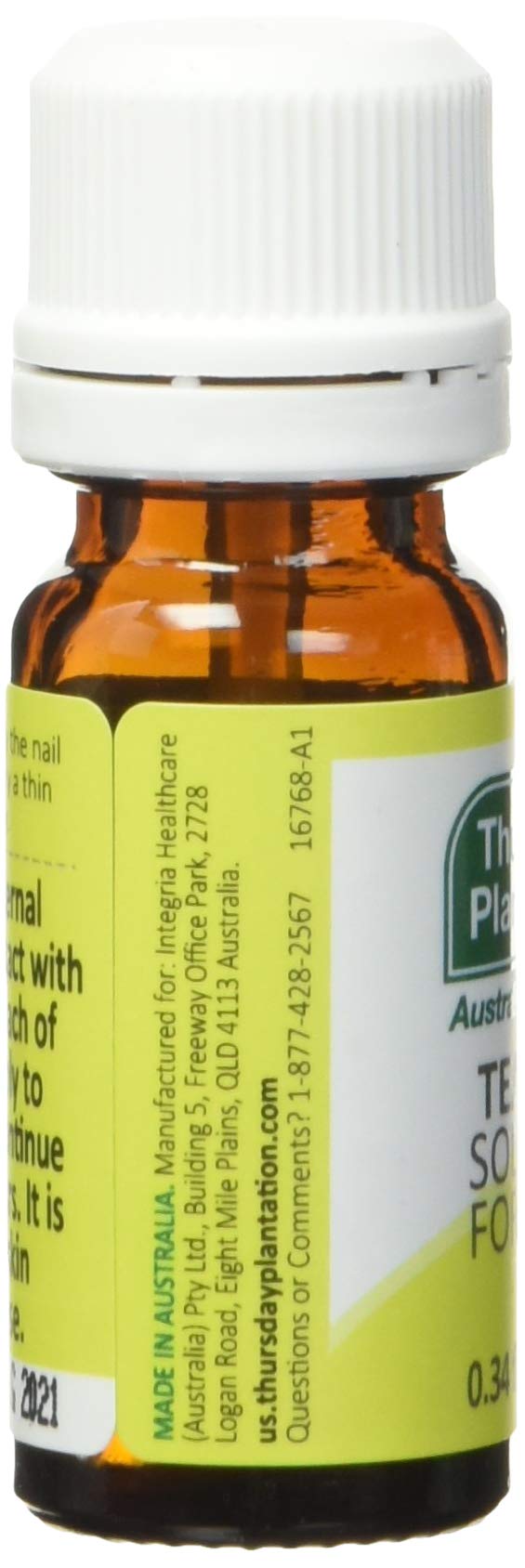 Thursday Plantation 10 ml bottle beside a coin illustrating compact travel-ready size