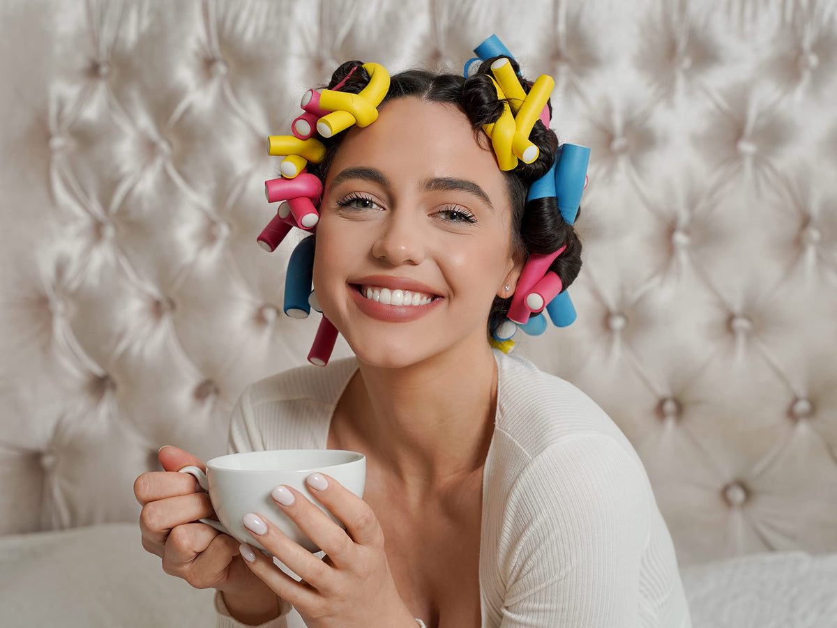 Tifara Beauty applying rollers to damp hair for faster styling results