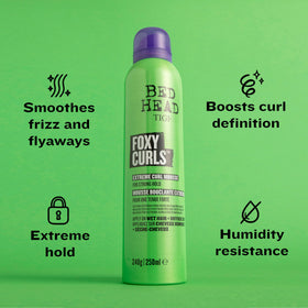 TIGI Bed Head bottle in hand for size comparison and portability