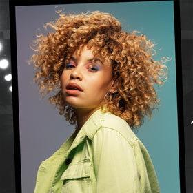 Diffuser drying curls treated with TIGI Catwalk cream for lifted, bouncy results