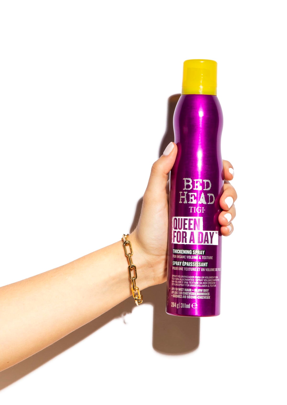 TIGI lifestyle shot with voluminous hair for a bold, crown-like finish