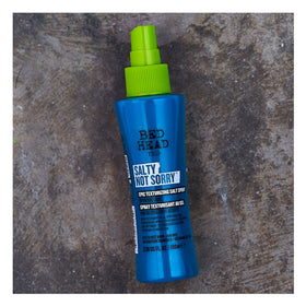TIGI bottle in bathroom lifestyle scene suggesting daily styling use