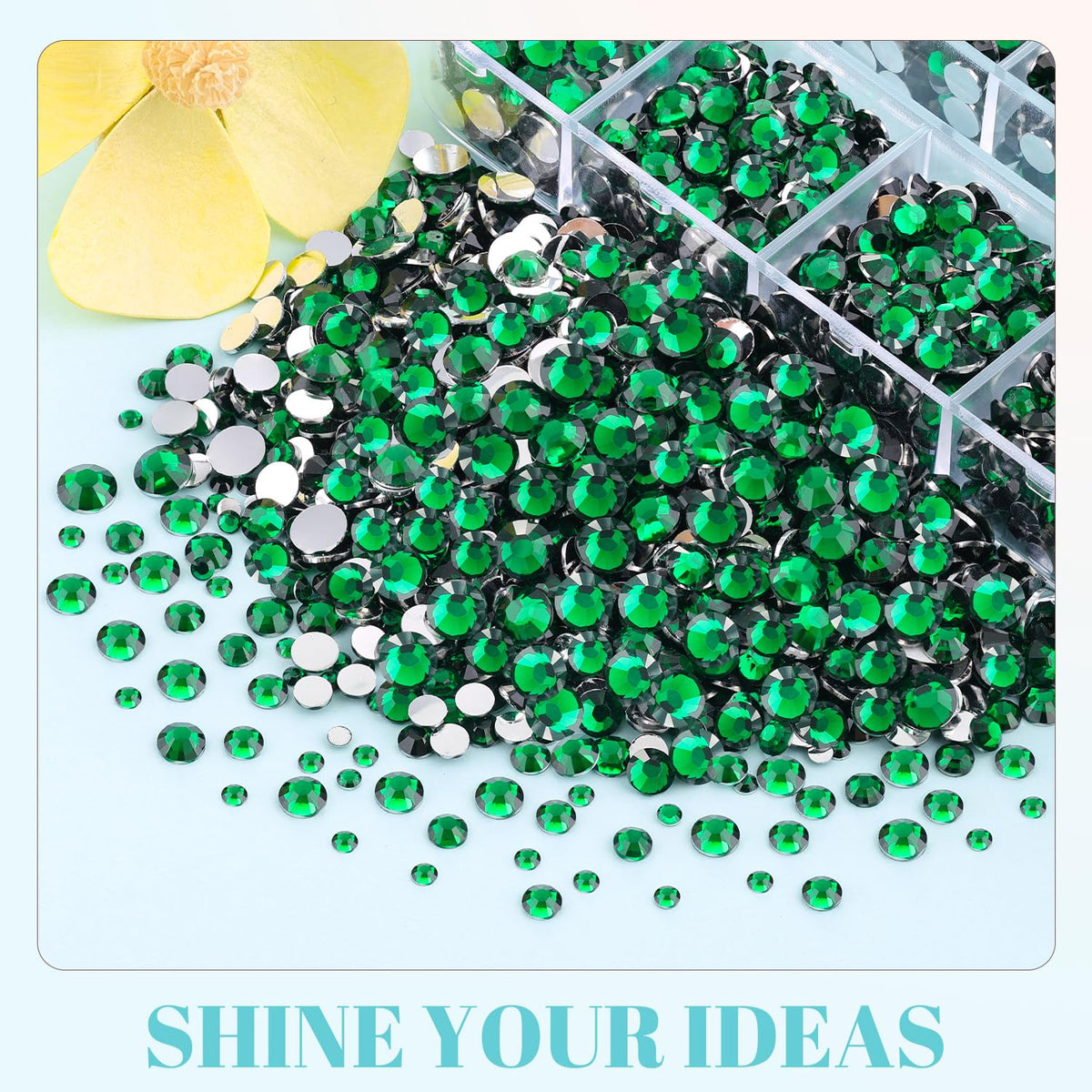 TINKRSTUFF rhinestones on a craft table staged with phone case and frame for inspiration