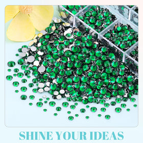 TINKRSTUFF rhinestones on a craft table staged with phone case and frame for inspiration