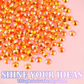 TINKRSTUFF decorated tumbler with orange AB gems demonstrating finished sparkle