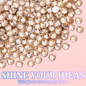 TINKRSTUFF 2–6mm rhinestones next to a coin to show scale for accurate sizing
