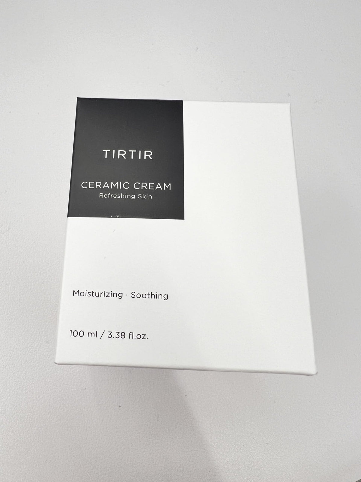 TIRTIR ceramic cream on nighttime bathroom shelf suggesting PM routine and restful hydration