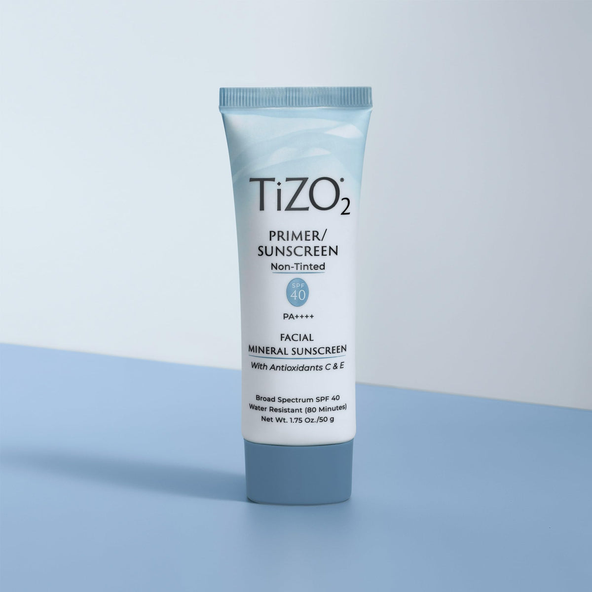 TIZO tube held in hand to show TiZO2 size and travel-friendly convenience