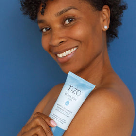 TIZO lotion swatch on hand demonstrating blendable tinted coverage