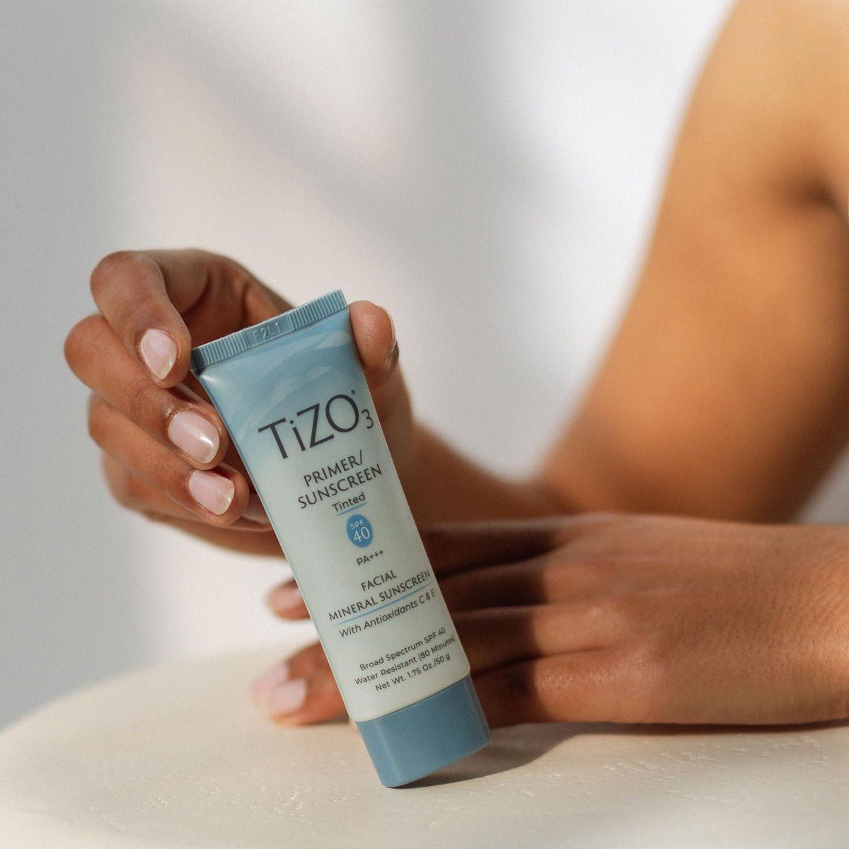 TIZO product label showing mineral ingredients and reef-friendly claim