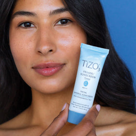 TIZO tube next to ruler to show 1.75 oz size and travel-friendly benefit