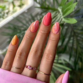 Tnbuokas close-up glossy almond nail texture highlighting smooth shine