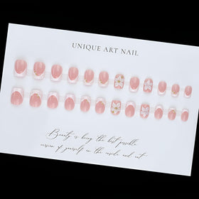 Tnbuokas hands applying press-on nails demonstrating quick salon result